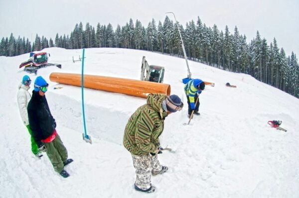Guys working in the snow park